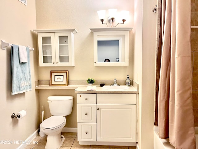 bathroom with tile patterned floors, vanity, and toilet