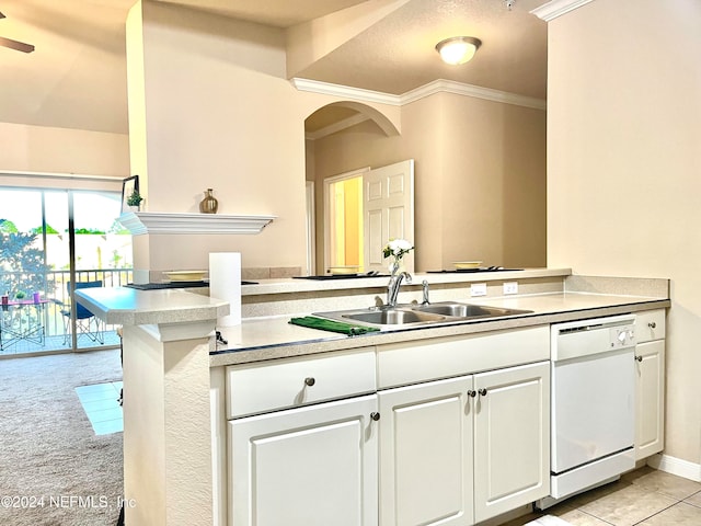 kitchen featuring dishwasher, kitchen peninsula, sink, ornamental molding, and white cabinetry