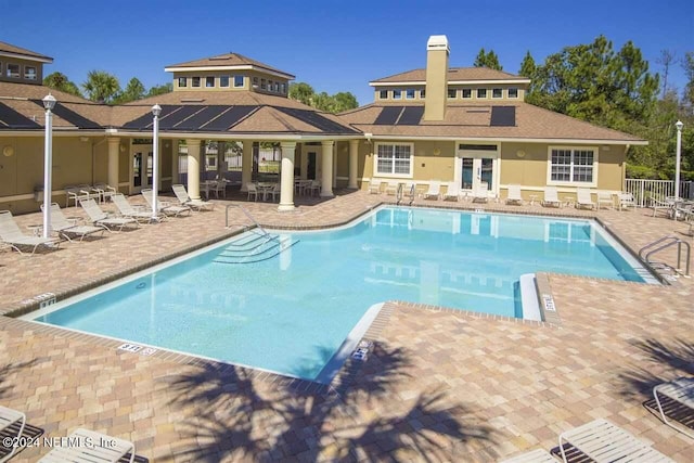 view of pool featuring a patio