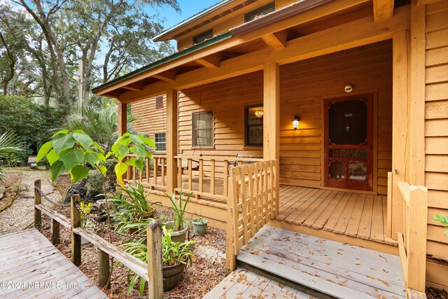 7816 Whispering Pines Ln, Glen St Mary, FL 32040 - doorway to property with a porch
