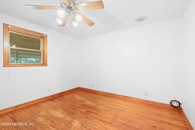 empty room with wood-type flooring and ceiling fan