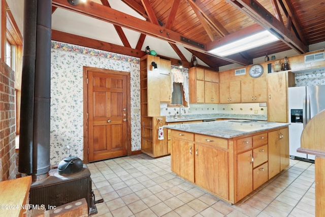 kitchen with a center island, sink, light tile patterned floors, stainless steel fridge with ice dispenser, and lofted ceiling with beams