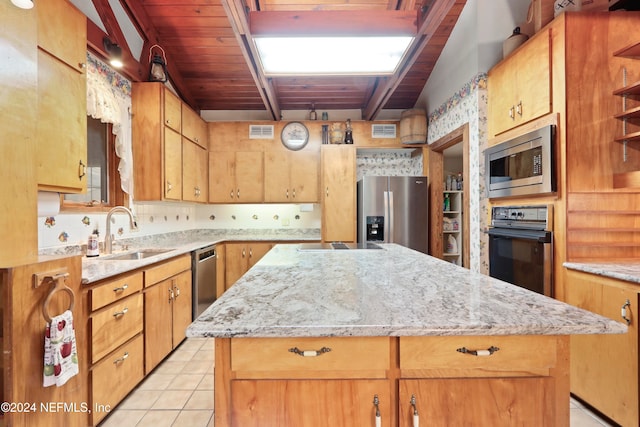 kitchen with stainless steel appliances, light tile patterned floors, wooden ceiling, a kitchen island, and lofted ceiling with beams