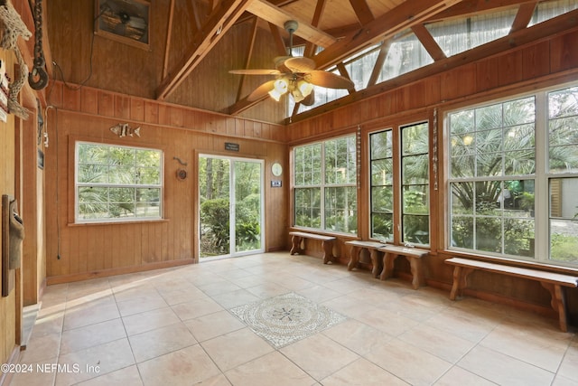 7816 Whispering Pines Ln, Glen St Mary, FL 32040 - unfurnished sunroom featuring lofted ceiling, tile patterned flooring, and wood walls