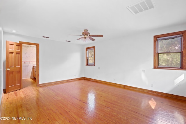 spare room featuring light hardwood / wood-style floors and ceiling fan