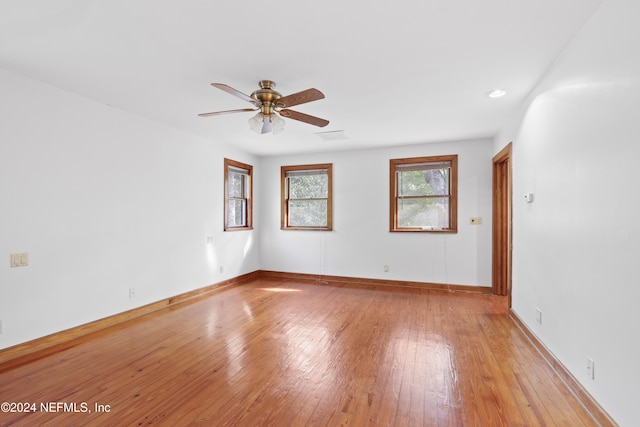 7816 Whispering Pines Ln, Glen St Mary, FL 32040 - spare room with light wood-style floors, a ceiling fan, and baseboards