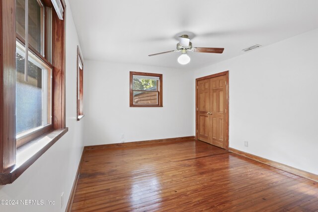 7816 Whispering Pines Ln, Glen St Mary, FL 32040 - unfurnished room with wood finished floors, baseboards, and a ceiling fan