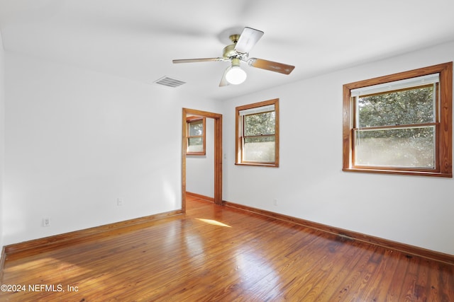 7816 Whispering Pines Ln, Glen St Mary, FL 32040 - unfurnished room with baseboards, wood finished floors, and ceiling fan