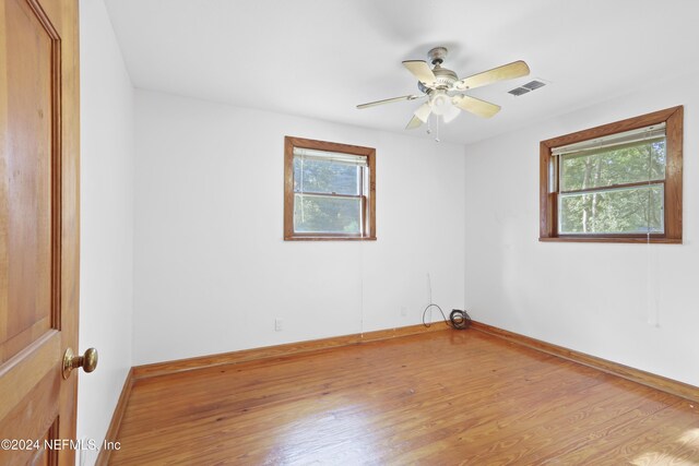 7816 Whispering Pines Ln, Glen St Mary, FL 32040 - spare room featuring healthy amount of natural light, wood finished floors, ceiling fan, and baseboards