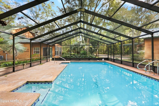 7816 Whispering Pines Ln, Glen St Mary, FL 32040 - outdoor pool featuring a patio area and a lanai