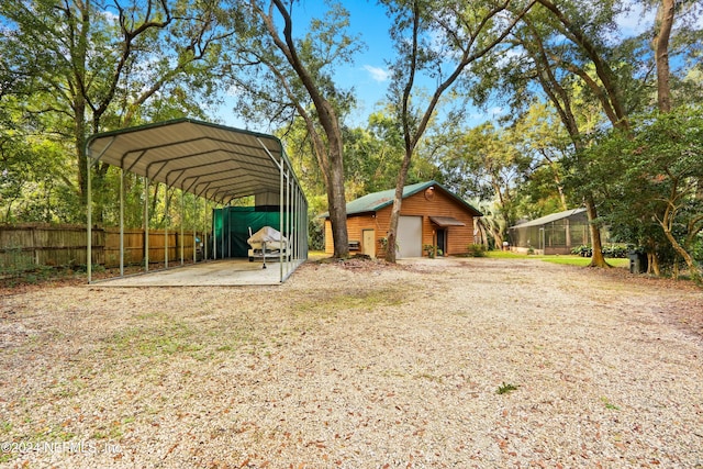 view of yard with an outdoor structure and a carport