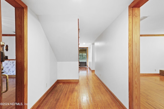 7816 Whispering Pines Ln, Glen St Mary, FL 32040 - corridor featuring wood-type flooring and baseboards