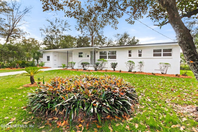 ranch-style house with a front yard