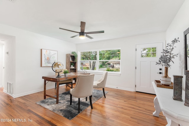 dining room featuring light hardwood / wood-style flooring and ceiling fan