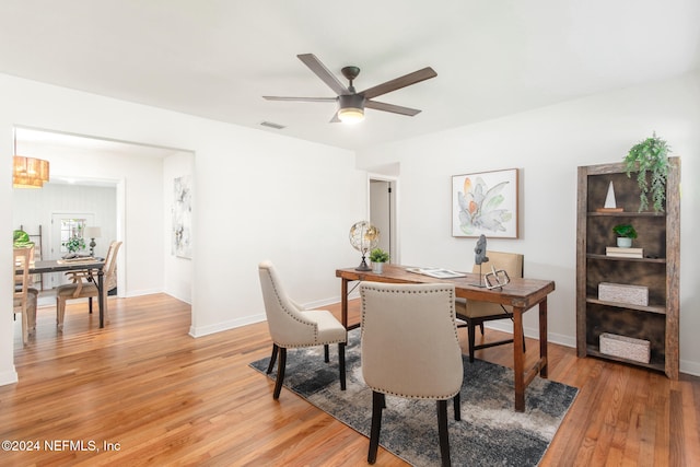 dining room featuring ceiling fan and light hardwood / wood-style flooring