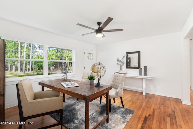 dining area featuring hardwood / wood-style flooring and ceiling fan