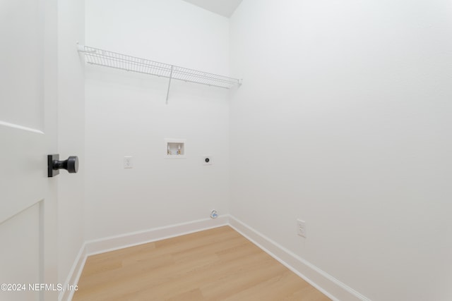 laundry room with hookup for an electric dryer, washer hookup, and hardwood / wood-style flooring