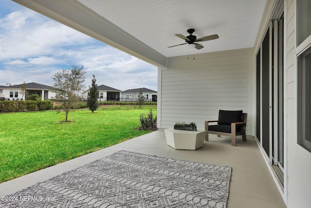 view of patio featuring ceiling fan