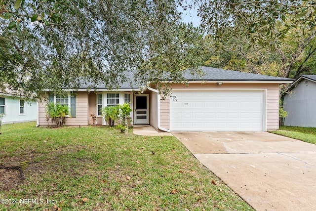 ranch-style home with a front yard and a garage