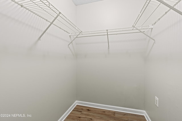 walk in closet featuring hardwood / wood-style floors