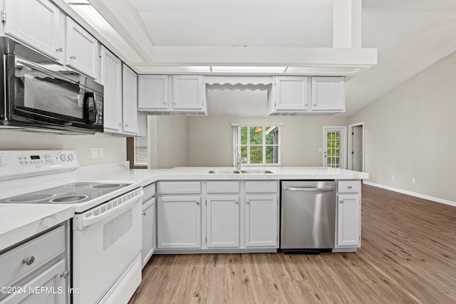 kitchen featuring light hardwood / wood-style floors, dishwasher, kitchen peninsula, electric range, and white cabinetry