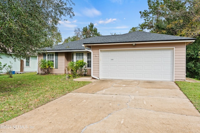 single story home with a front lawn and a garage