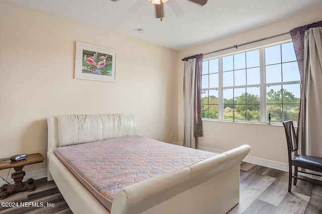 bedroom featuring ceiling fan and wood-type flooring