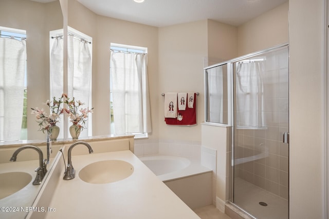 bathroom with plus walk in shower and vanity