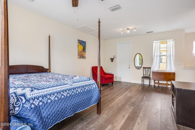 bedroom featuring ceiling fan and wood-type flooring