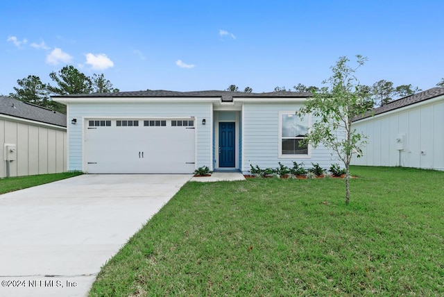 ranch-style home with a garage and a front lawn