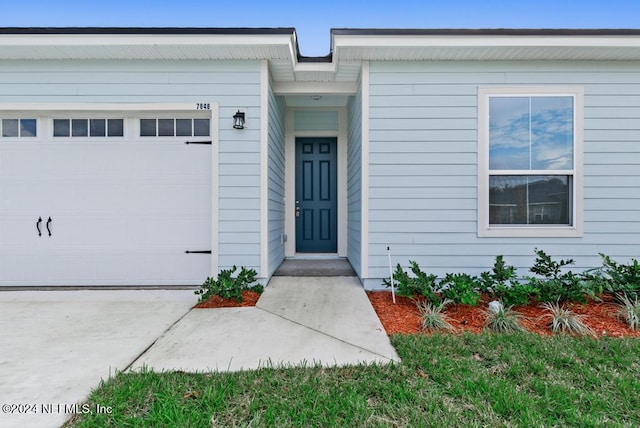 property entrance featuring a garage