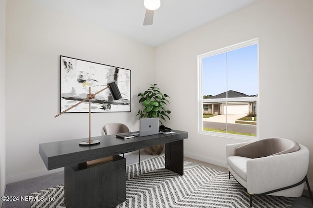 carpeted office with ceiling fan