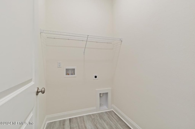 laundry area with light wood-type flooring, electric dryer hookup, and hookup for a washing machine