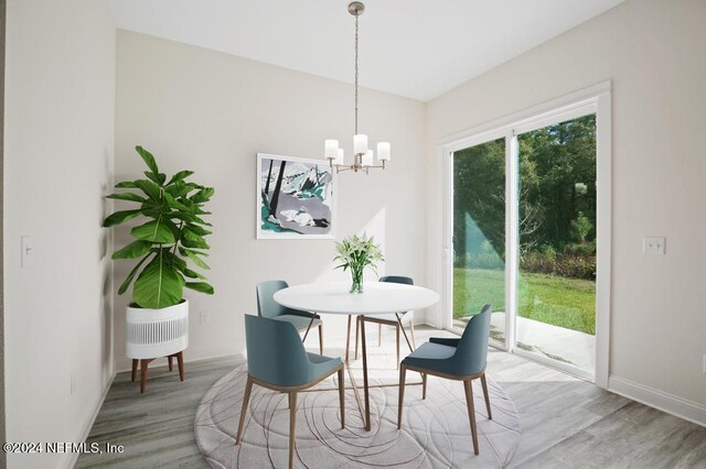 dining room featuring hardwood / wood-style floors and a notable chandelier