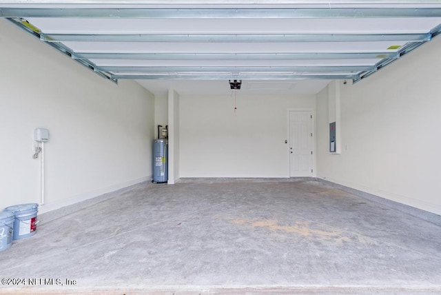 garage with electric panel, water heater, and a garage door opener