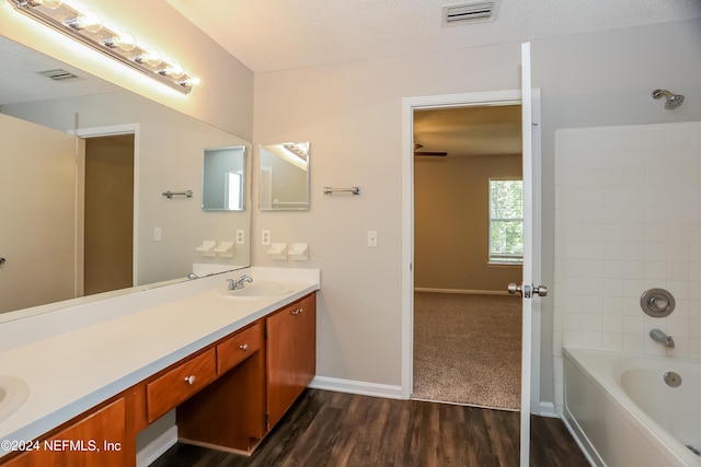 12229 Mastin Cove Rd, Jacksonville, FL 32225 - full bathroom featuring wood finished floors, double vanity, baseboards, and shower / tub combination