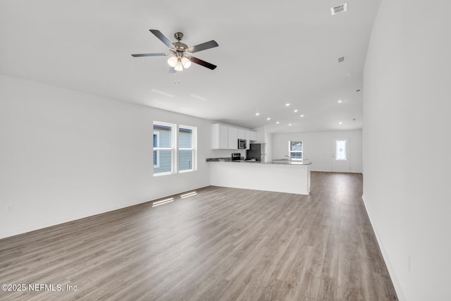 37343 Whisper Way, Hilliard, FL 32046 - unfurnished living room with recessed lighting, wood finished floors, a ceiling fan, and baseboards