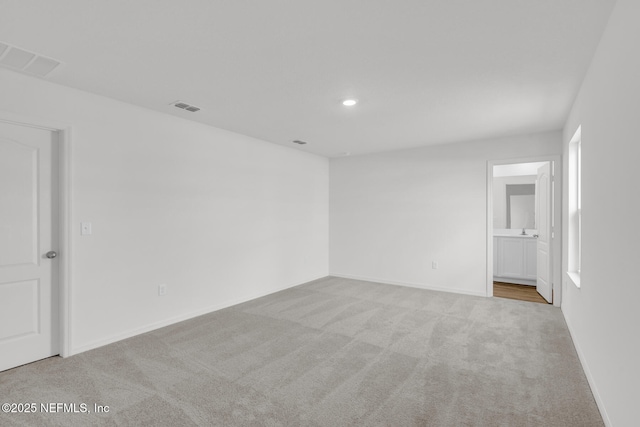 37343 Whisper Way, Hilliard, FL 32046 - unfurnished bedroom with carpet flooring, baseboards, recessed lighting, and ensuite bathroom