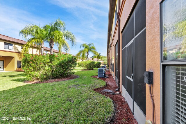 view of yard featuring central AC