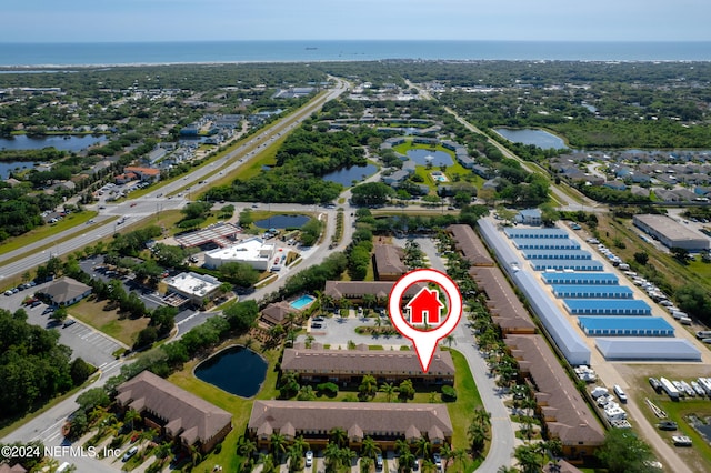 birds eye view of property featuring a water view