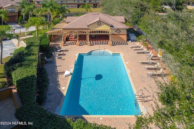 view of swimming pool featuring a patio area