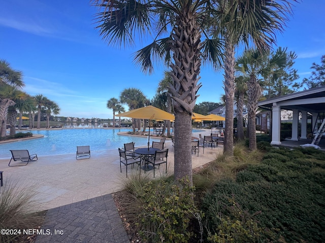 exterior space featuring a water view and a patio area