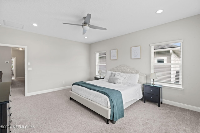 bedroom featuring ceiling fan and light colored carpet