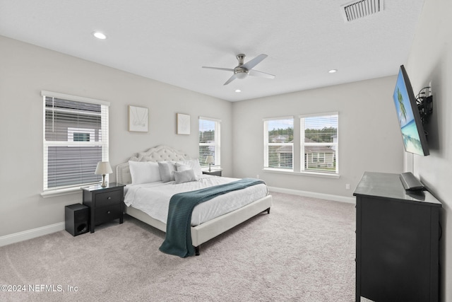 carpeted bedroom featuring ceiling fan