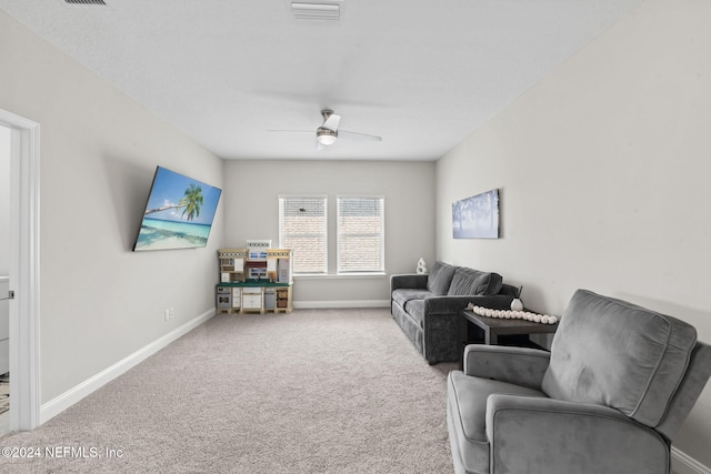 living room featuring ceiling fan and carpet flooring