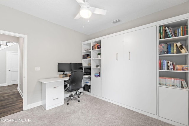 office area featuring light carpet and ceiling fan