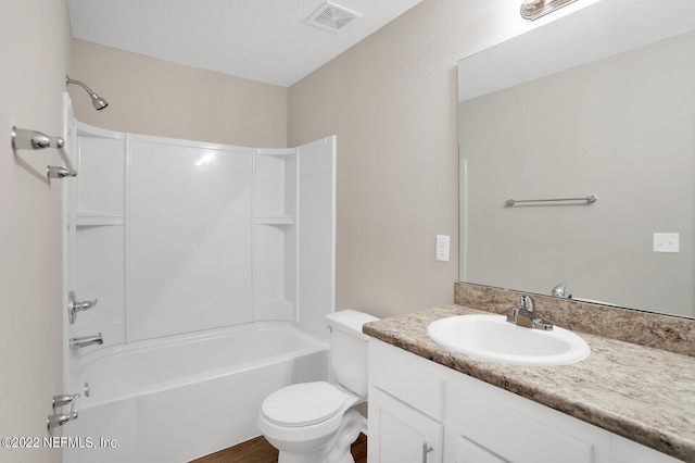 full bathroom featuring toilet, vanity, and bathing tub / shower combination