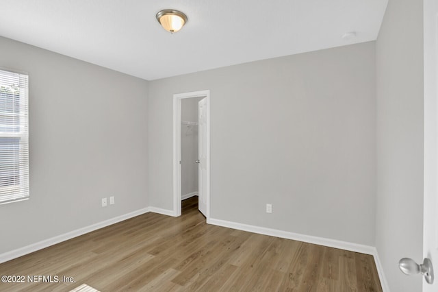 unfurnished room with light hardwood / wood-style flooring