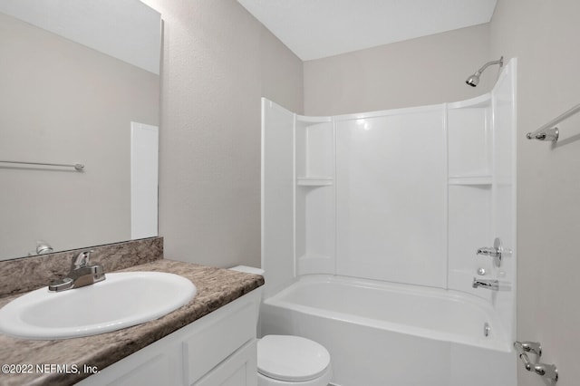 full bathroom with washtub / shower combination, vanity, and toilet