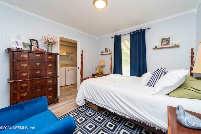 bedroom with ornamental molding, light wood-type flooring, and independent washer and dryer